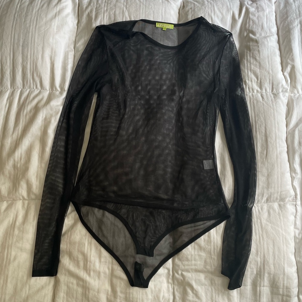 Mesh body suit.